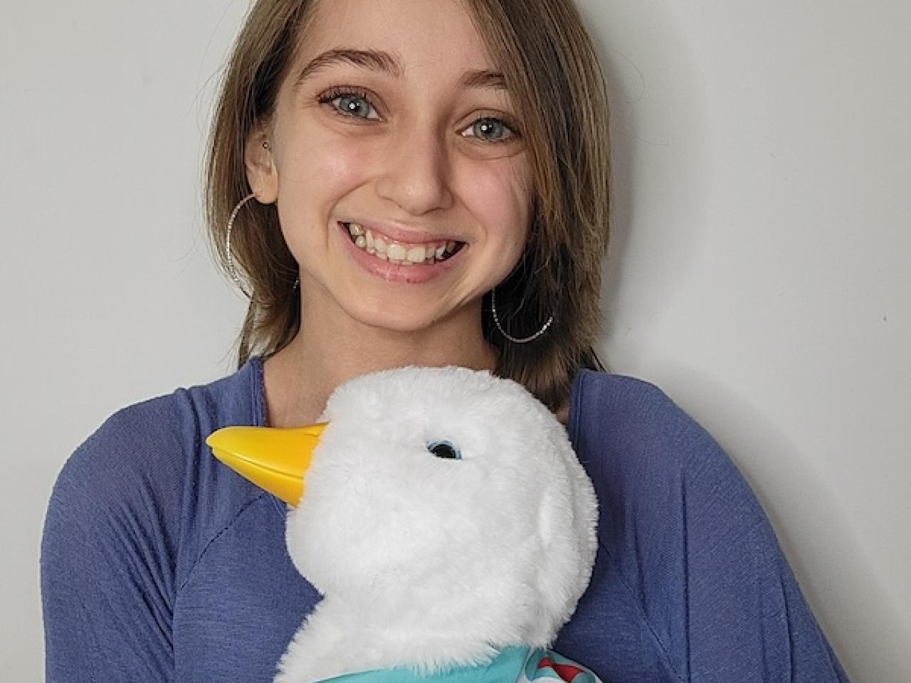 Photo of Shauna Rae holding an Aflac Duck.