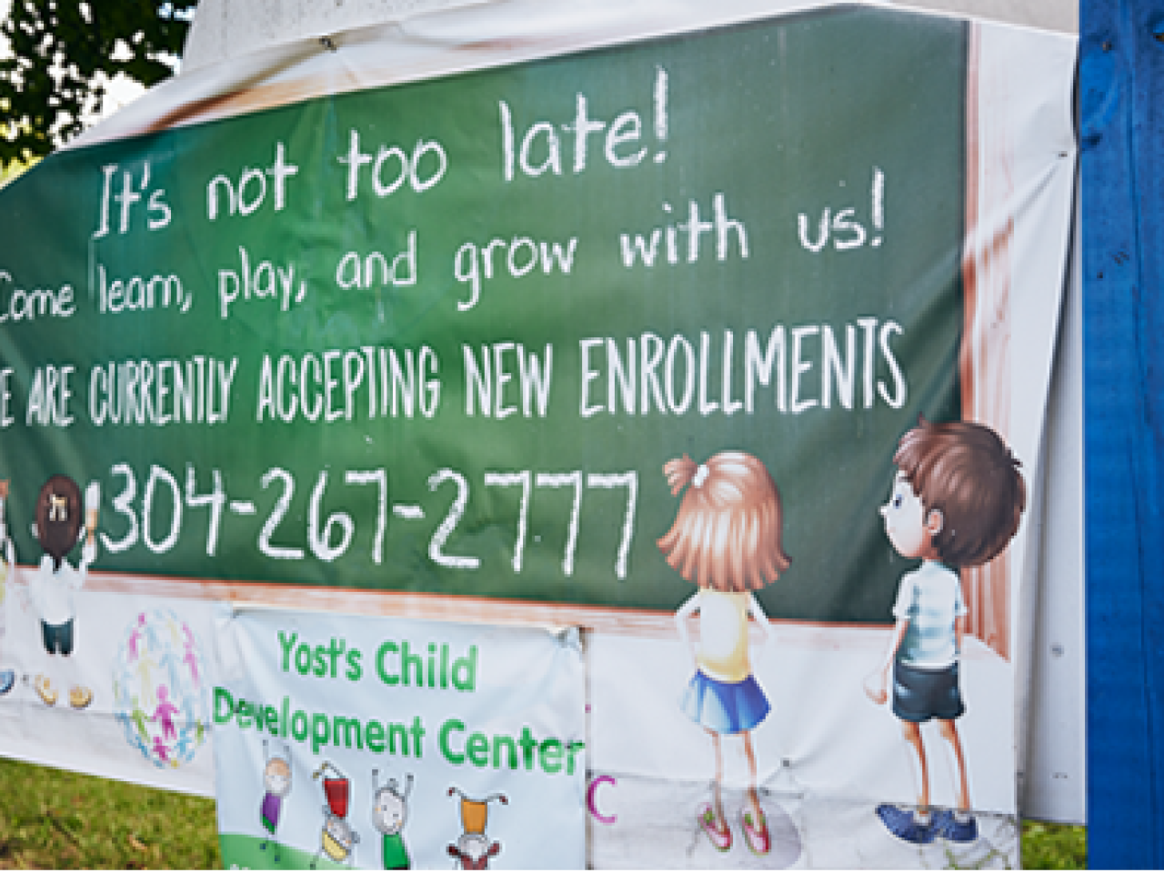 Sign reading 'It's not too late! Come learn play and Grow with us! We are currently accepting new enrollments'