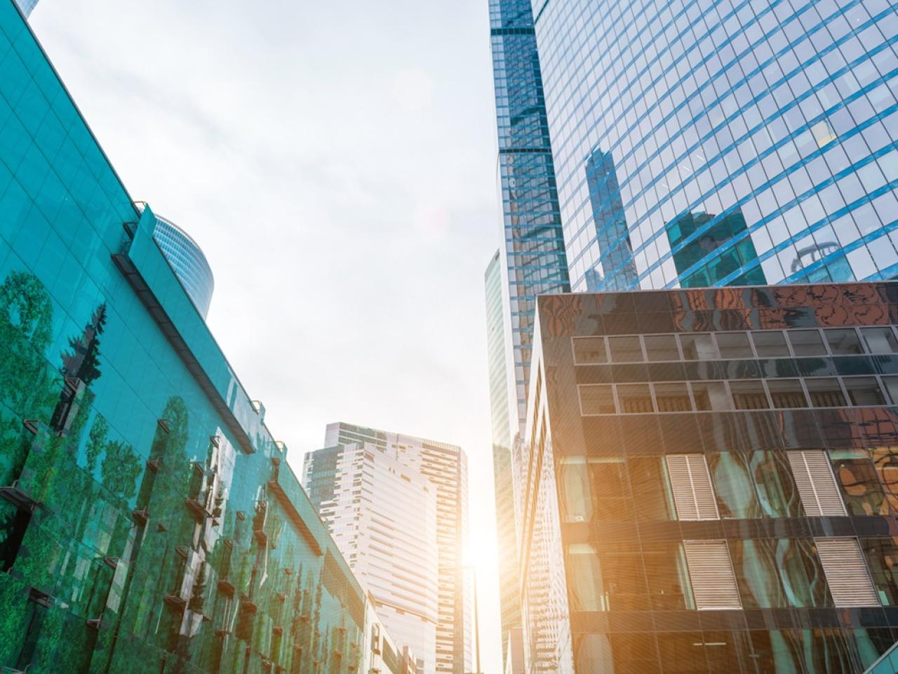 Sunlight peeking through high rise commercial buildings