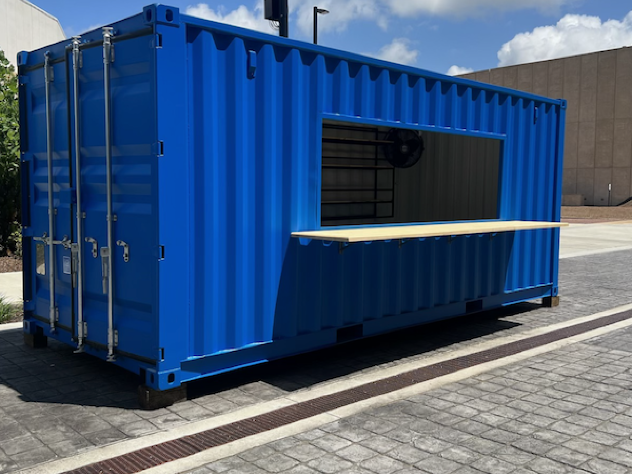 Blue up-cycled shippping container mobile retail space