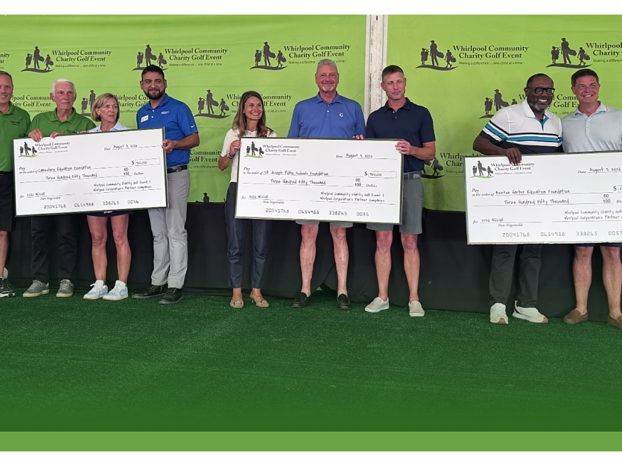 people holding up charity checks