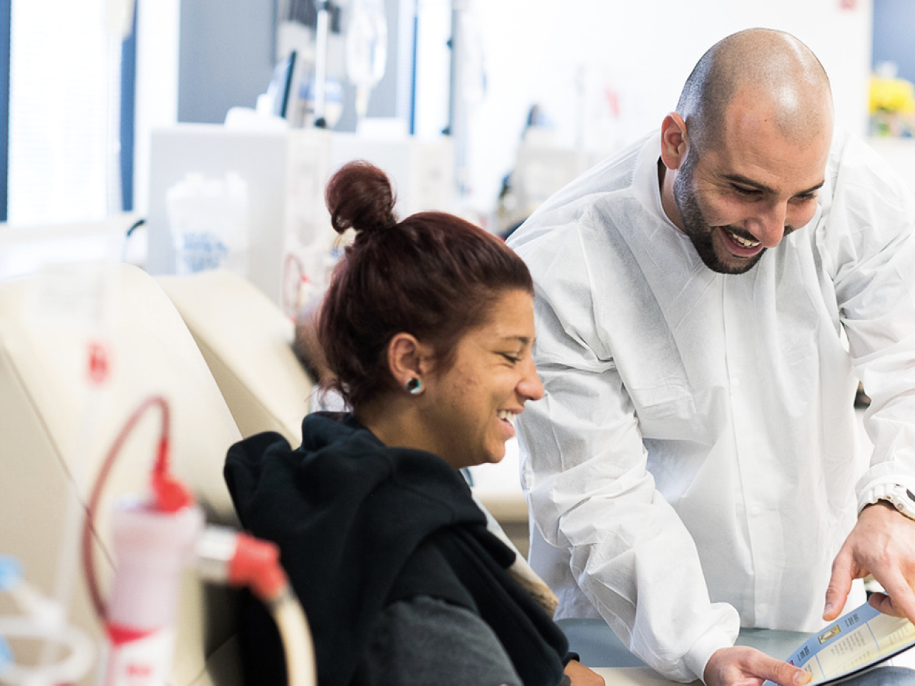 person working with a nurse