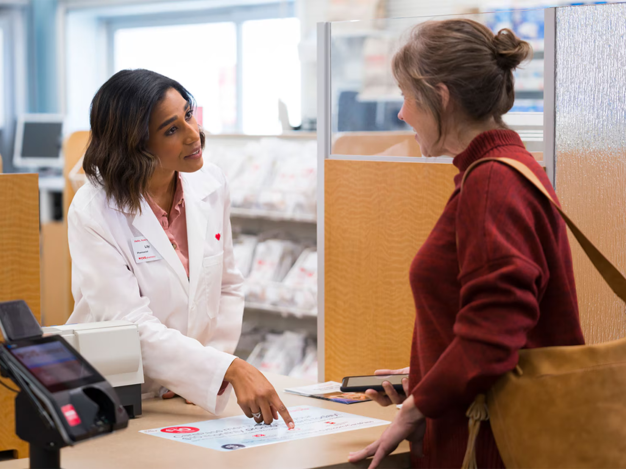Pharmacist working with a customer