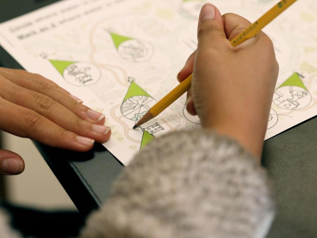 Child drawing on a piece of paper