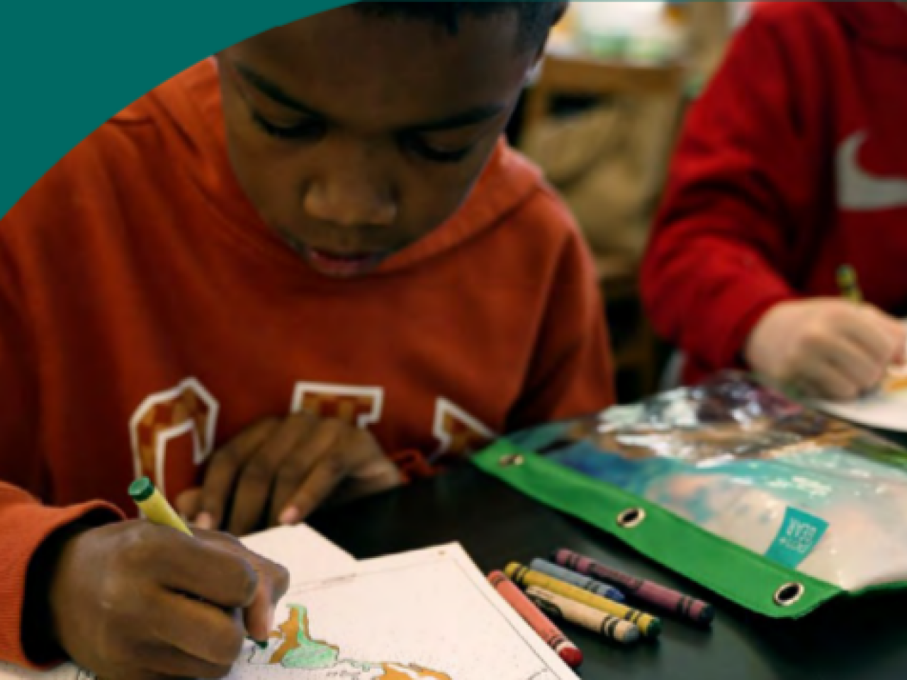Children coloring pages next to each other.