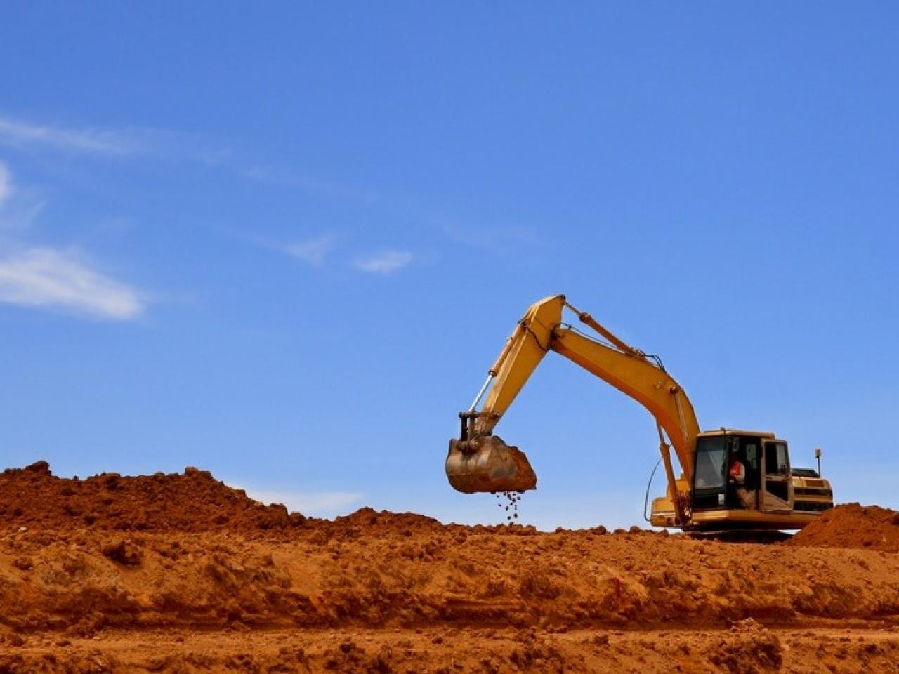Landscape shot of an excavator digging in soil