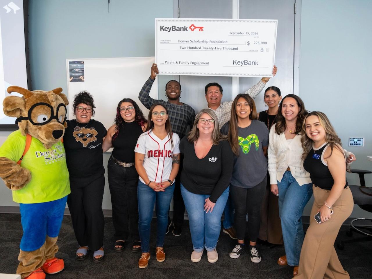 KeyBank and representatives from the Denver Scholarship Foundation shown with a check for $225,000.