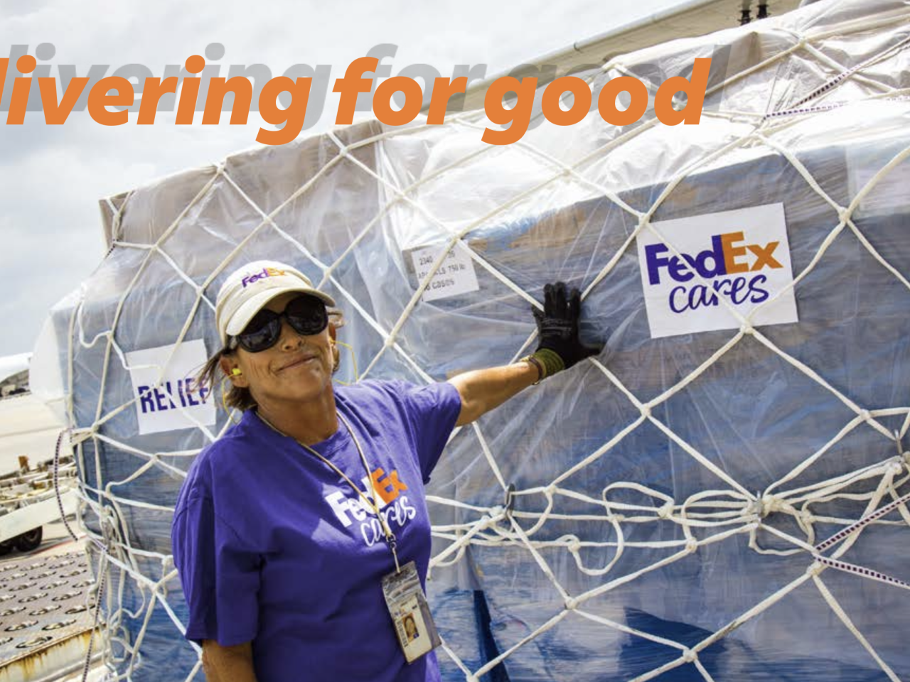 Woman standing in front of FedEx Cares cargo
