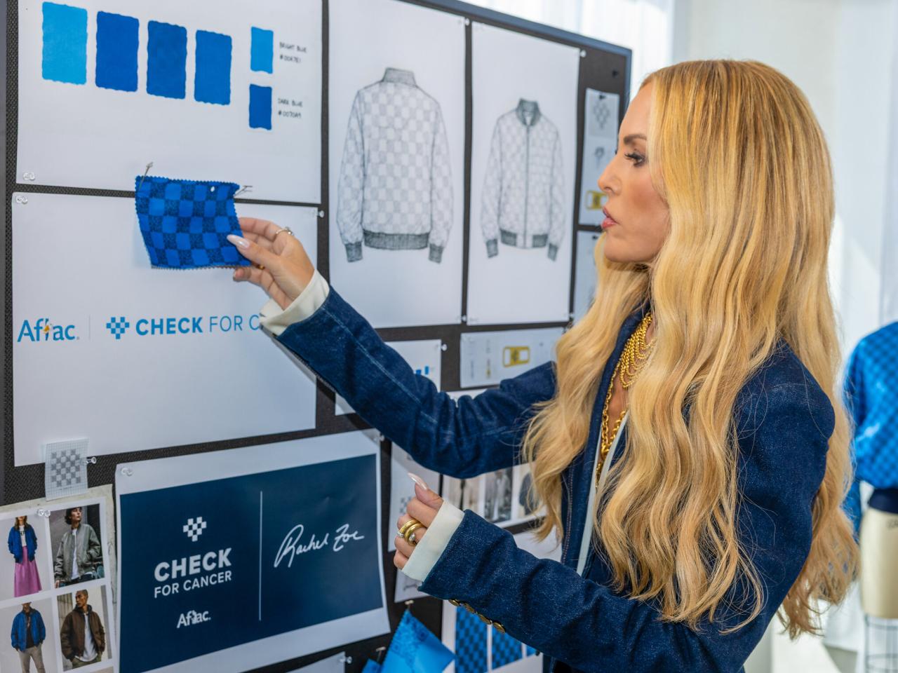 Fashion designer Rachel Zoe works on a limited-edition jacket she designed with Aflac that includes a QR code prompting people to Check for Cancer, because early detection can help save lives.