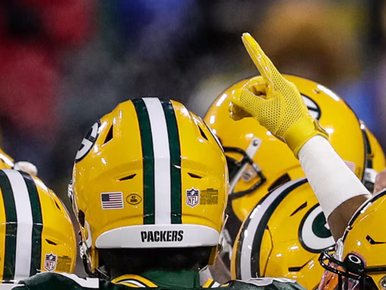 Green Bay Packers in a huddle.