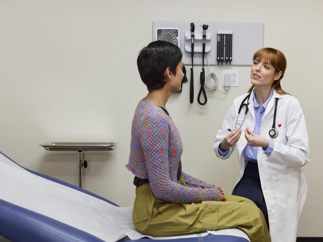 A woman being examined by a female doctor.