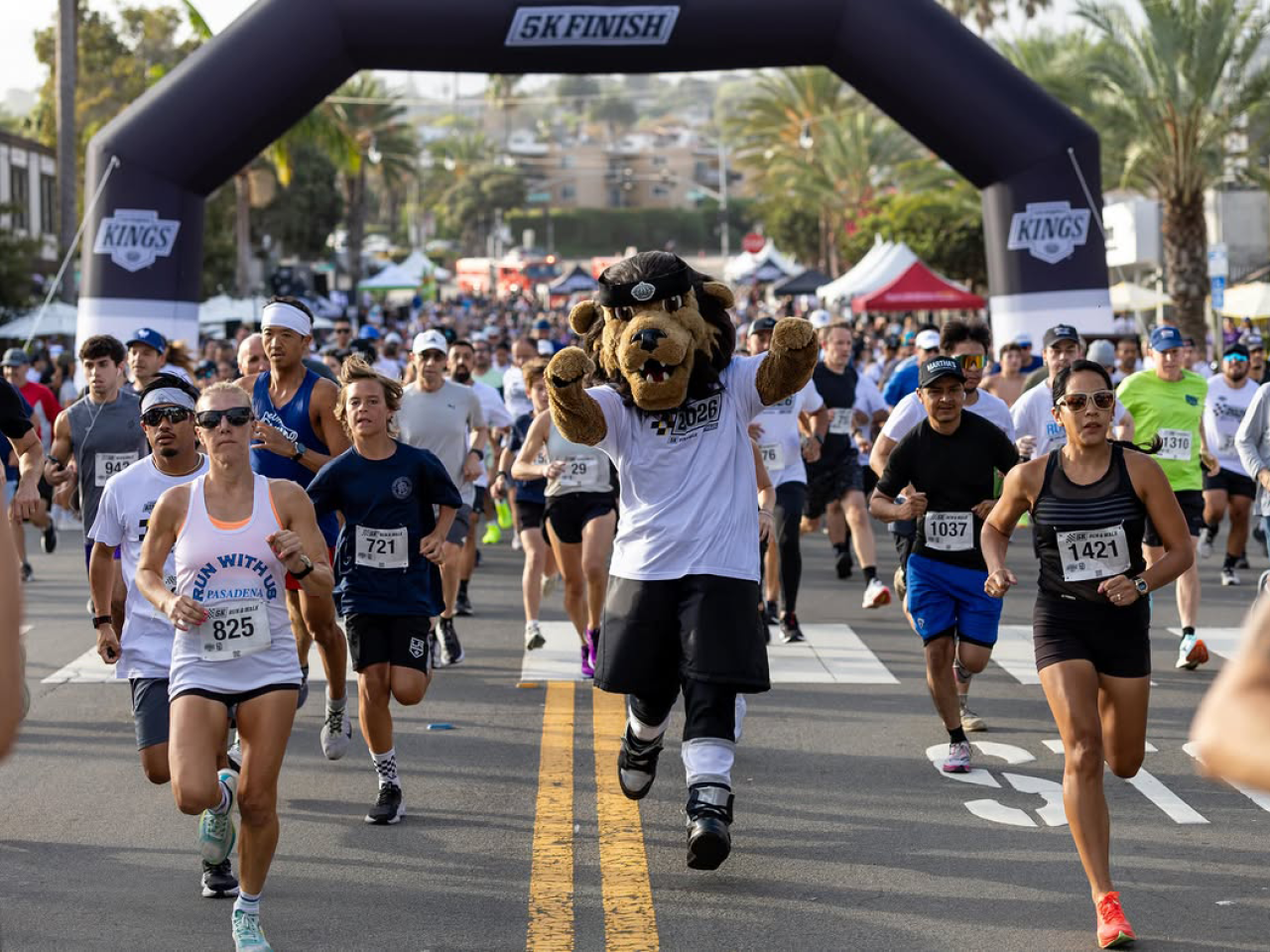LA Kings Mascot Bailey running with arms pumped up aside runners
