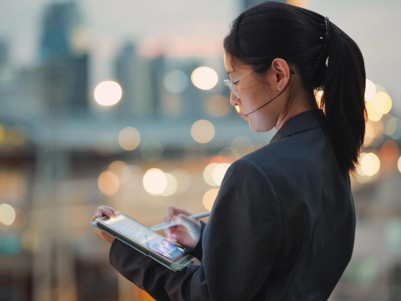 Global investor coding business AI tools on a digital tablet