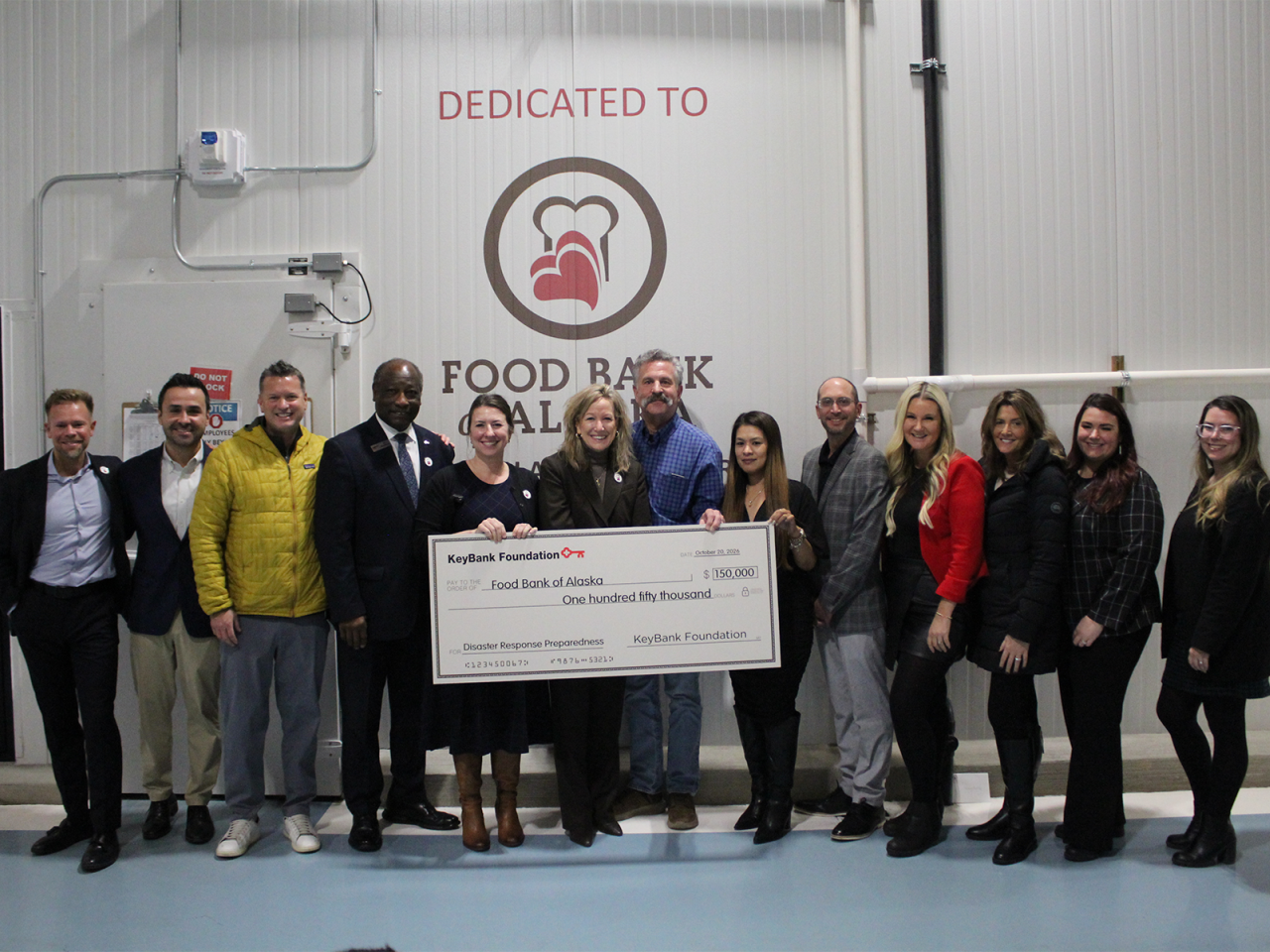 KeyBank and Alaska Food Bank Team members shown with a $150,000 grant check.