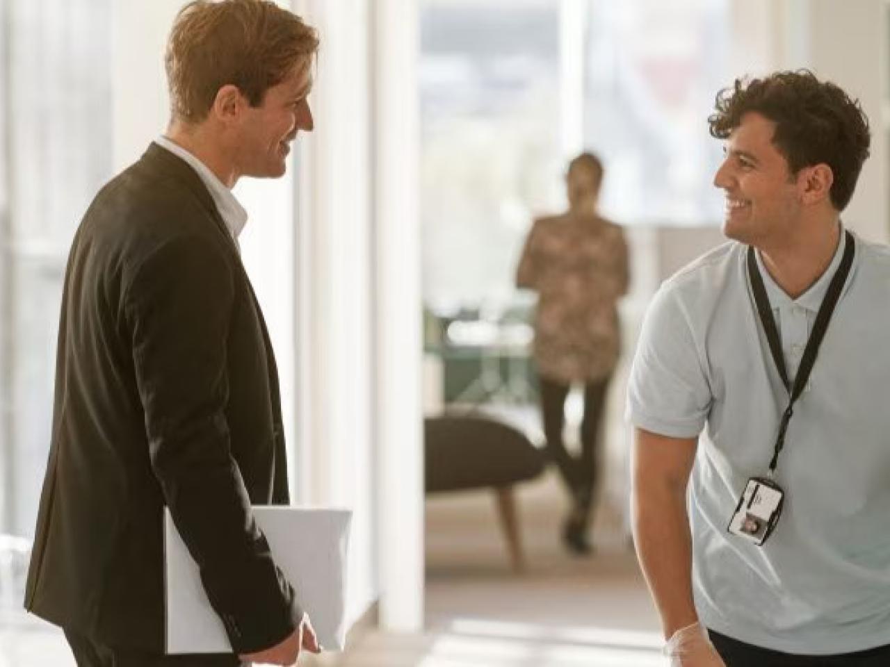 Two people having a discussion in an office.