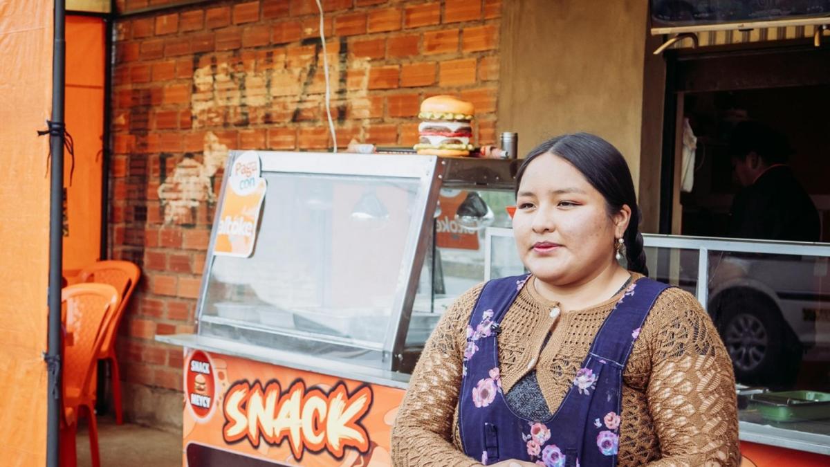 person standing in front of a snack store