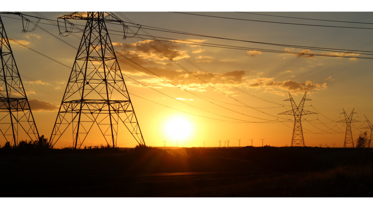 Phone lines with sunset in the background