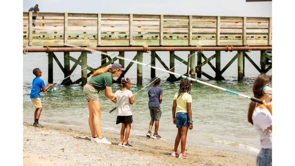 Instructor and kids fishing