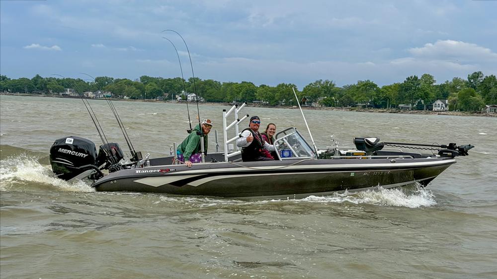 Detroit refinery Board Operator Fred Wickenheiser drives his boat with veterans for a day of fishing.