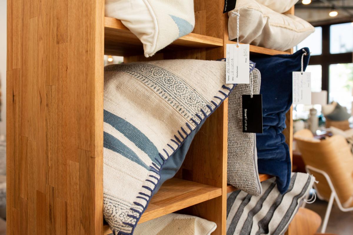 pillows on shelf in home furnishings store