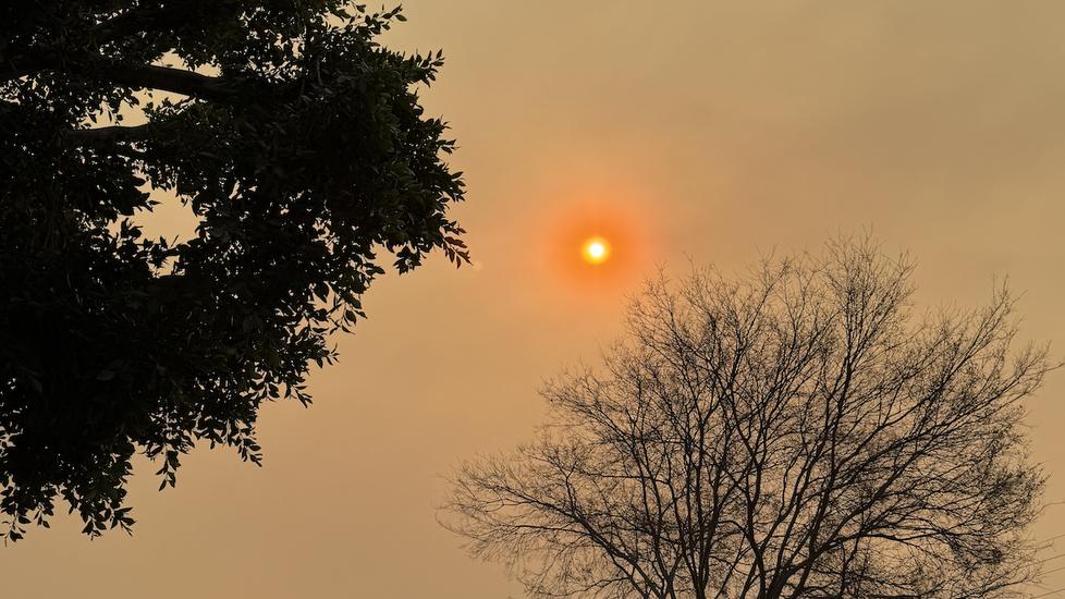 Sun behind smoky sky