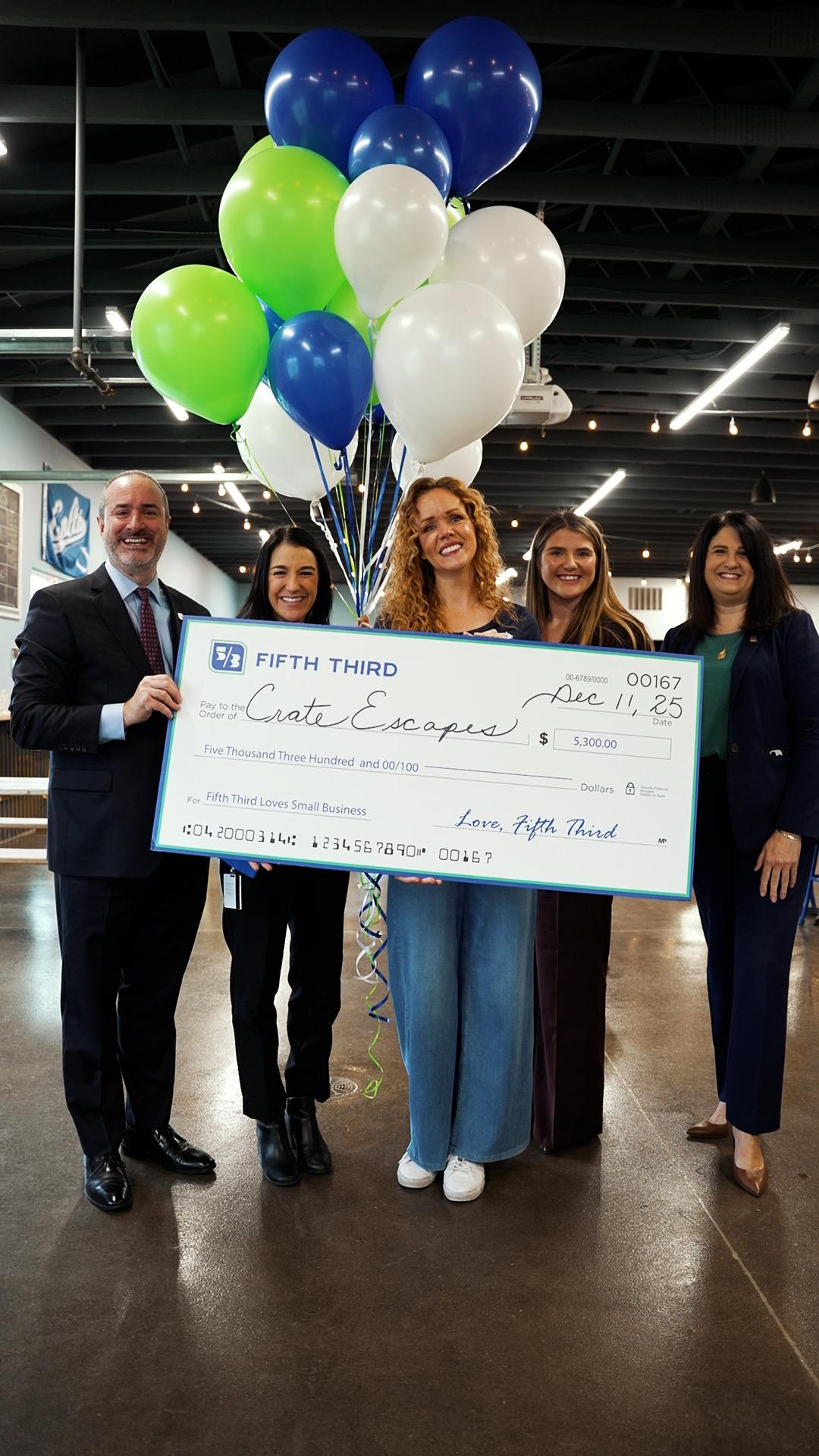 Crate Escapes Dog Park receiving grant check from Fifth Third
