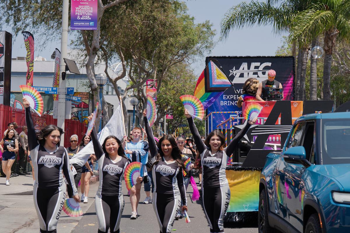 LA Kings Ice Crew march in front of AEG Pride float