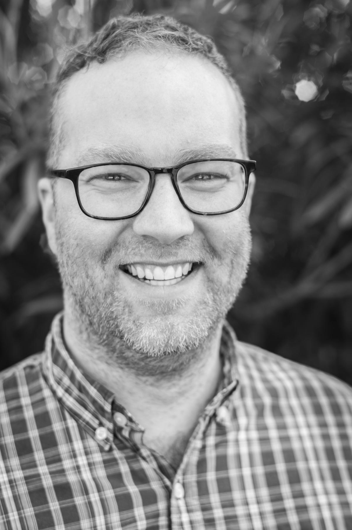 Black & white headshot of Logan Duran