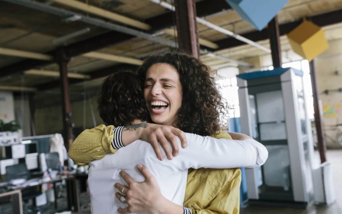 Two people embracing and smiling