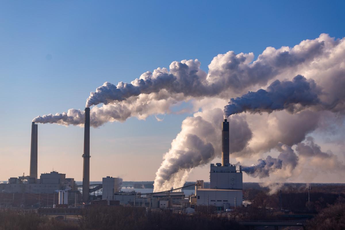 Emissions rising from facility smoke stacks