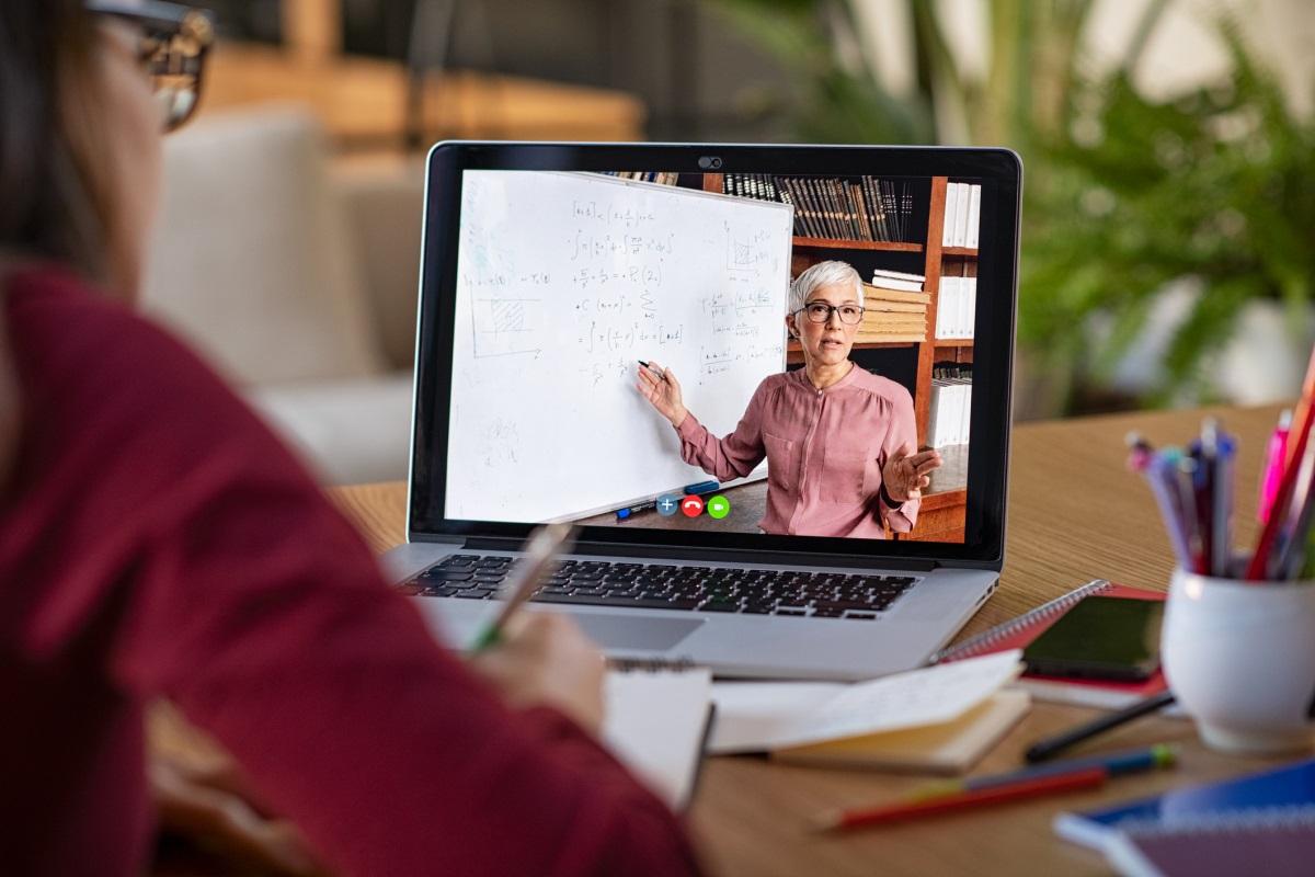 Woman teaching via a video call on laptop