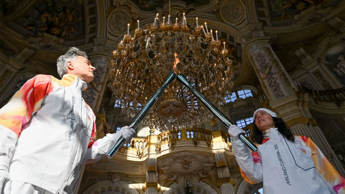 Two people lighting torches