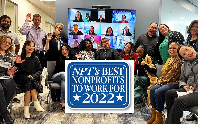 America's Charities Staff - some standing, some sitting, and some whose faces are visible on computer monitors - smile and wave at the camera