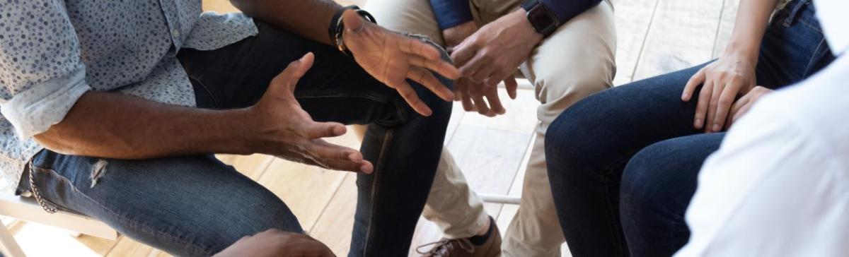 group of hands at a meeting