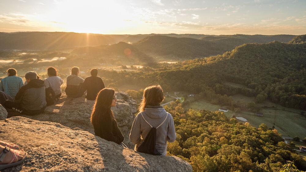 people watching the sunset
