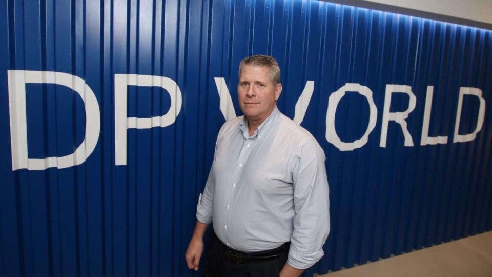 Doug Smith stands in DP World entryway at the company's office in the Vancouver metro area.