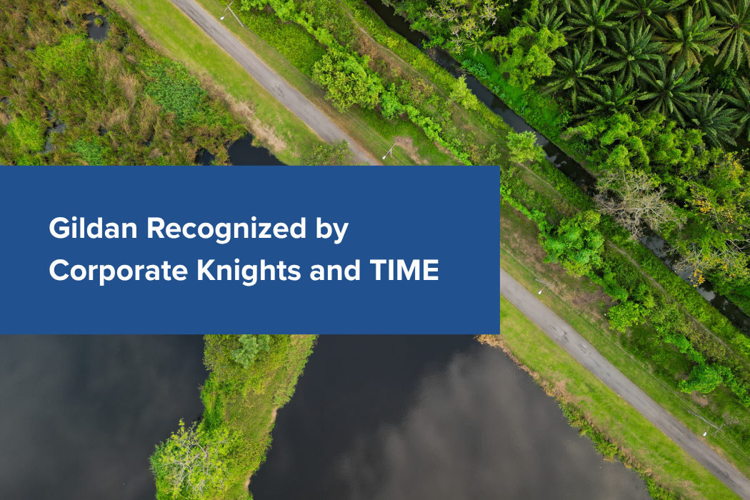 "Gildan Recognized by Corporate Knights and TIME" printed on backdrop of trees and water. 