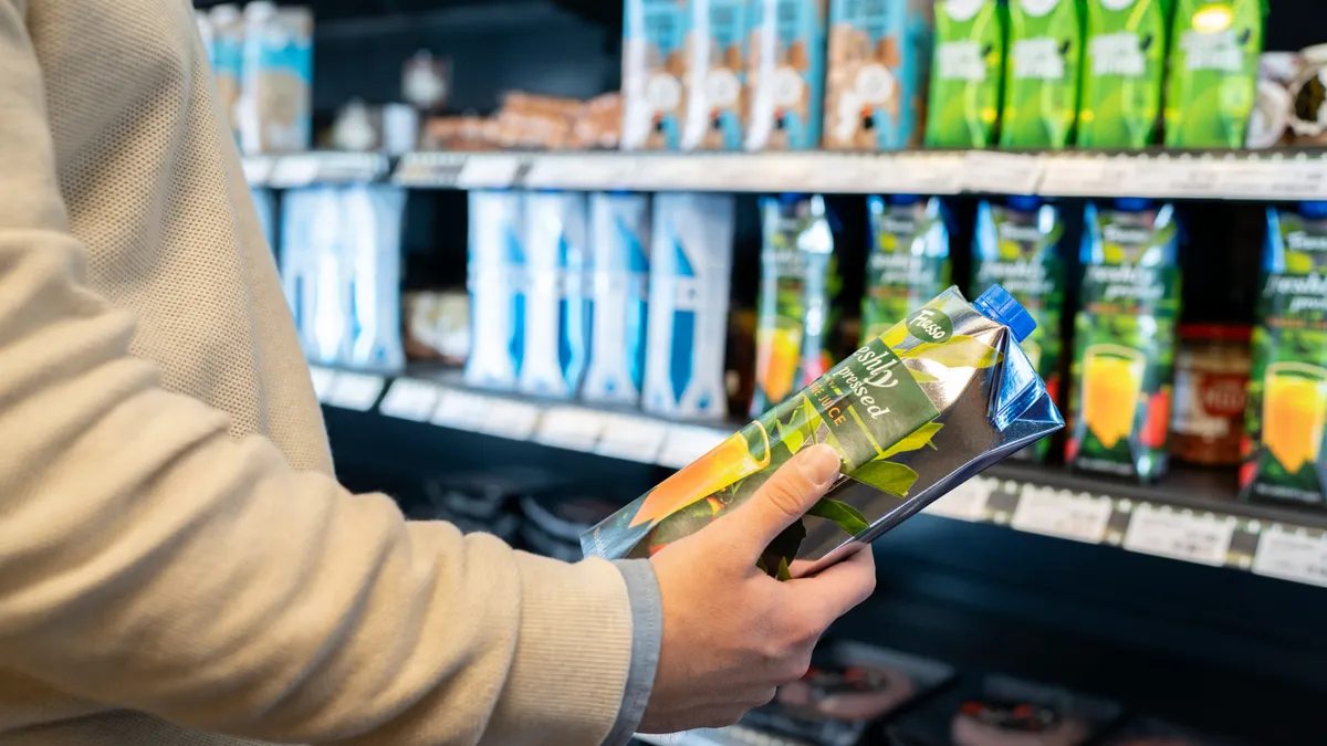 Someone in a grocery store examining an item
