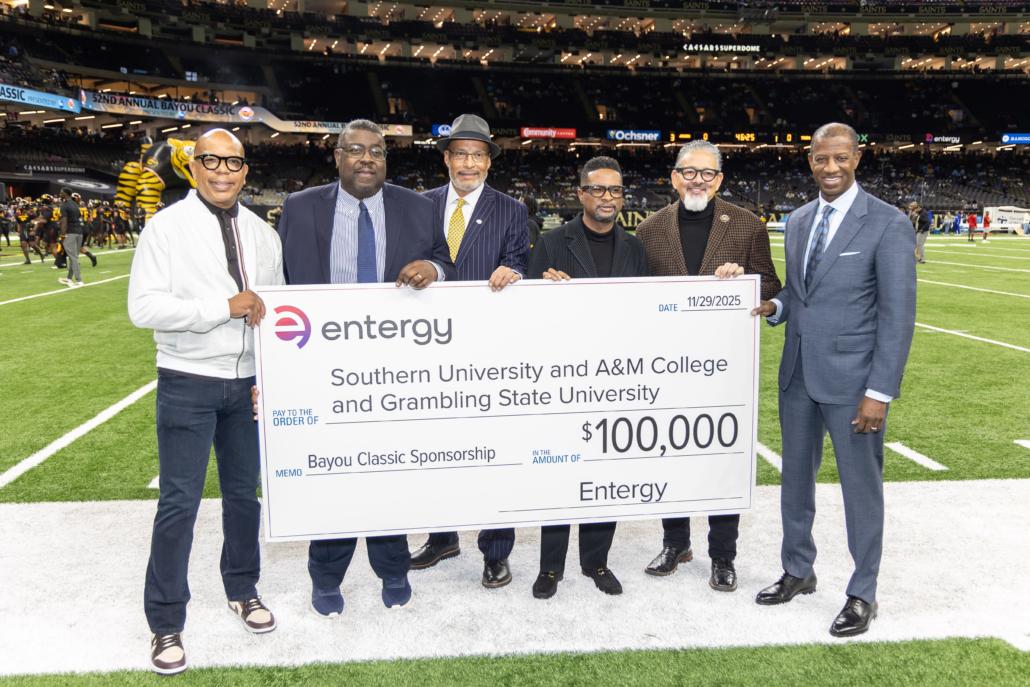 group holding up large check