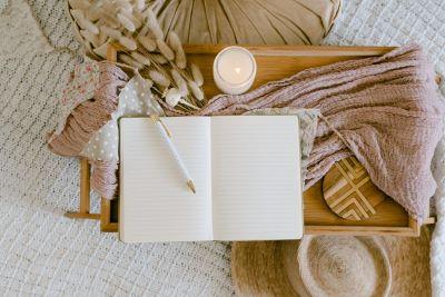 A blank journal shown with a pencil.
