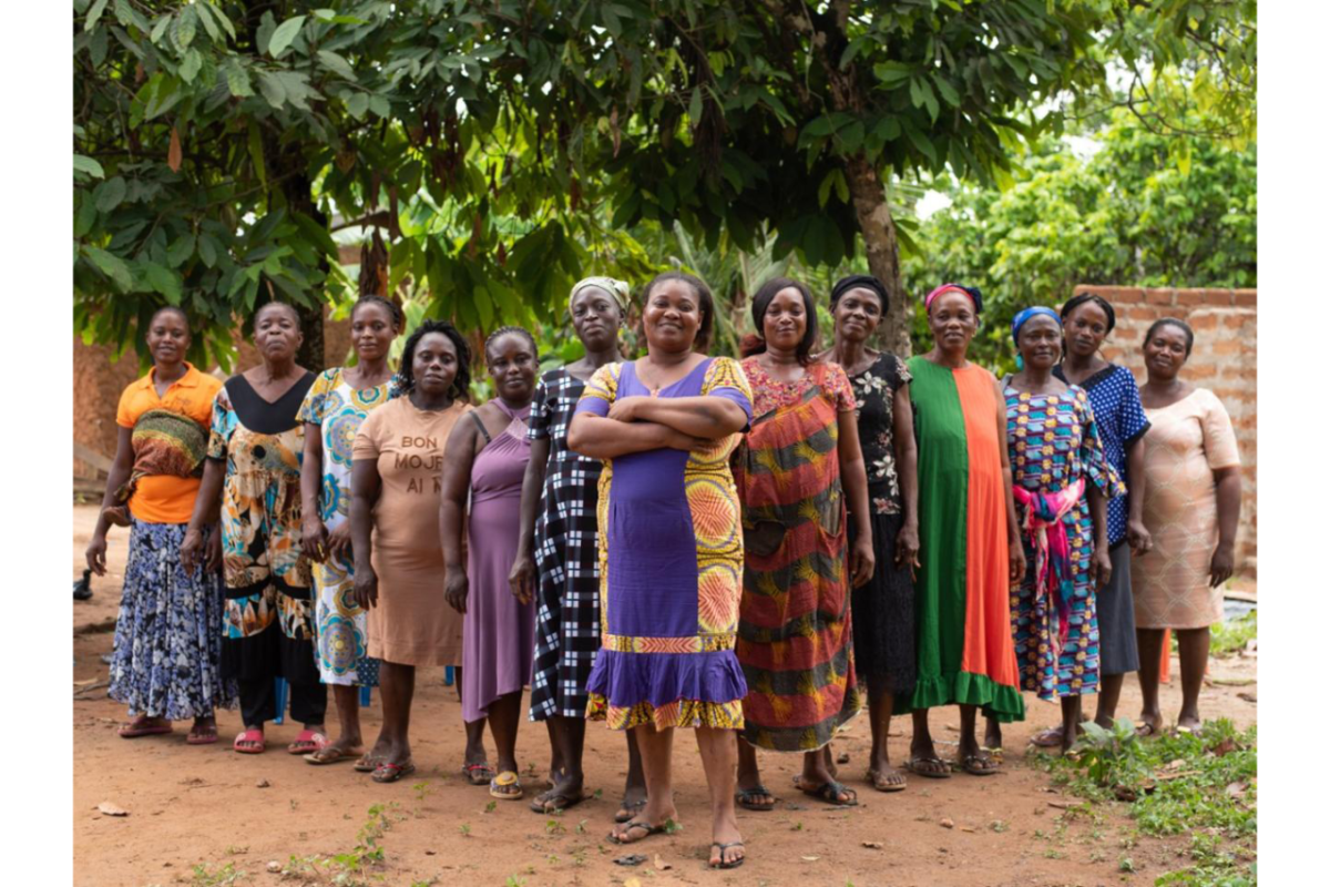 Group of women in a Ghanaian Village Savings and Loan Association stand together