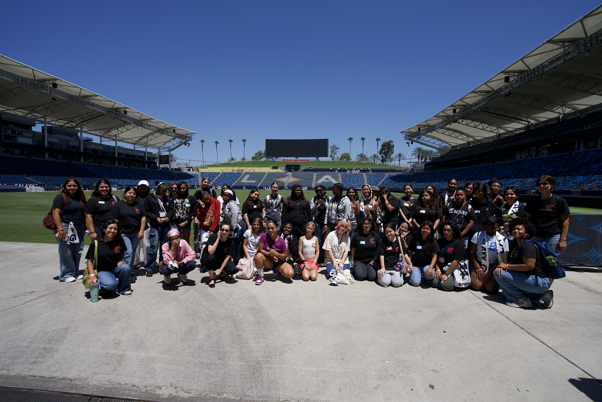 Girls Inc. of Los Angeles participants gather at Dignity Health Sports Park for a group photo during an educational and empowerment experience hosted with the LA Galaxy.
