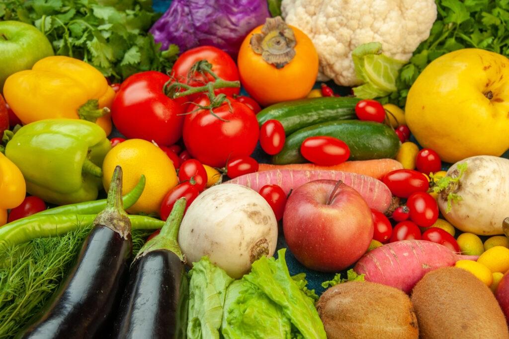 Tabletop with fruits and vegetables.