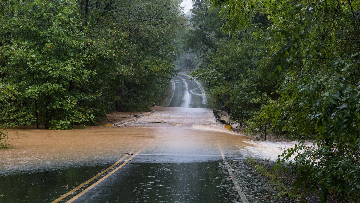 Road washed out by rushing water