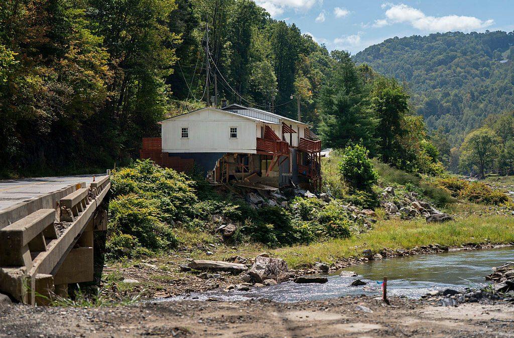 Photo of a house on a riverbank.