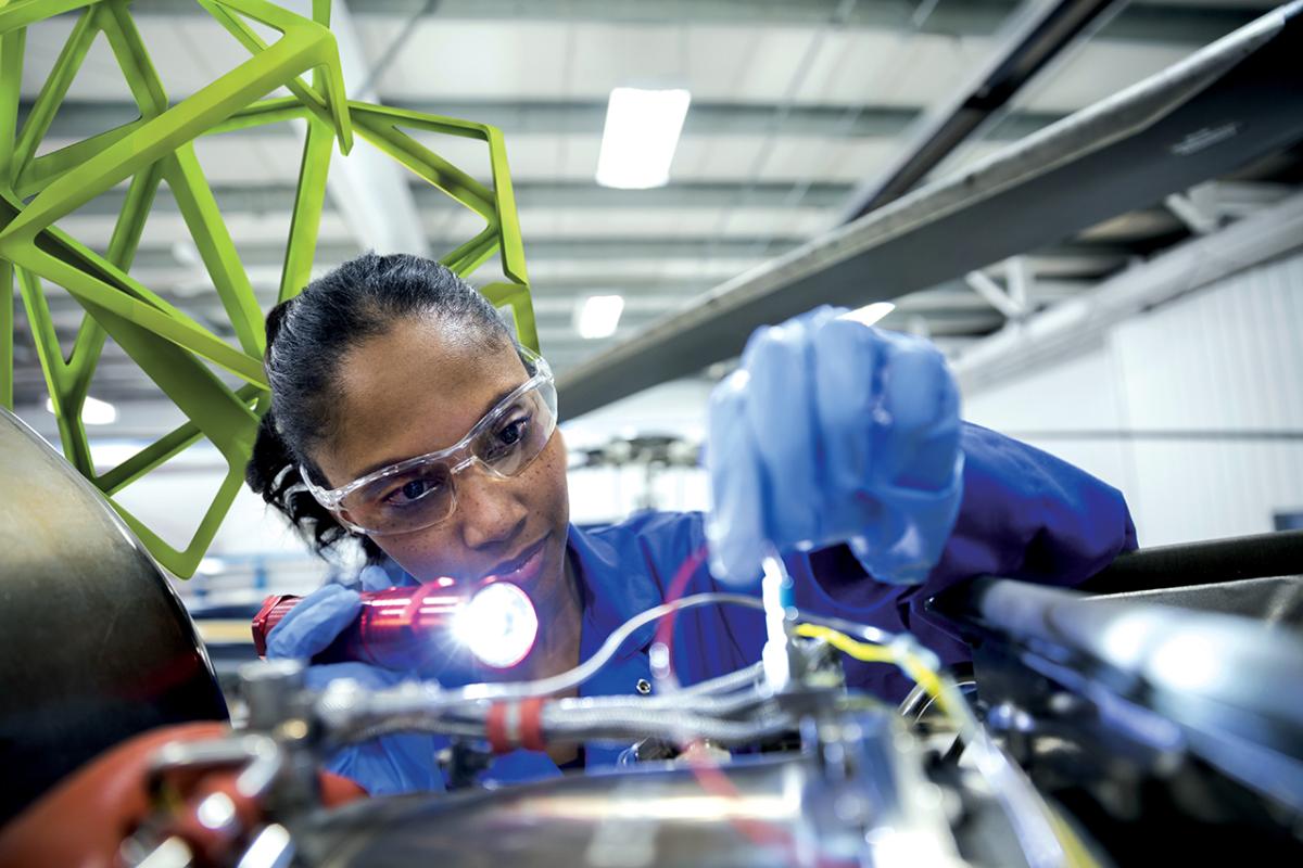 MilliporeSigma employee inspecting wires