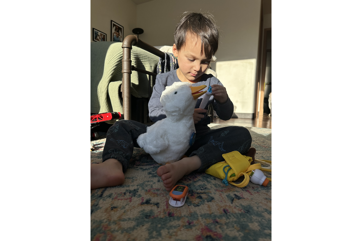 Arlo holding his feathered friend