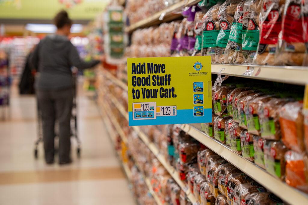 Grocery store aisle with a Guiding Stars sign on a shelf.