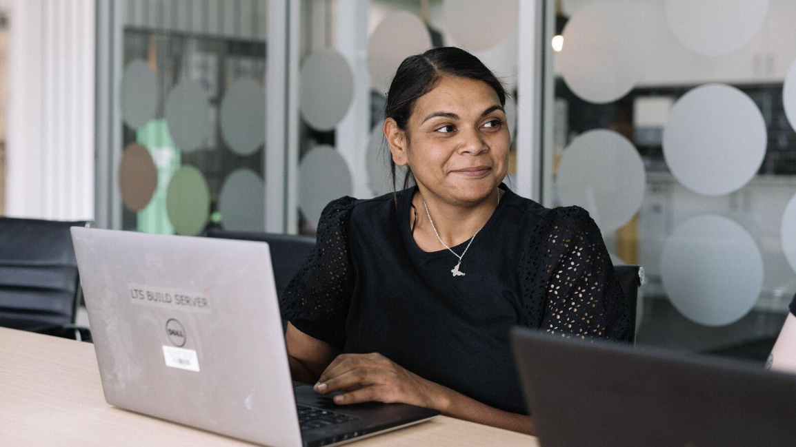 Woman on laptop in office