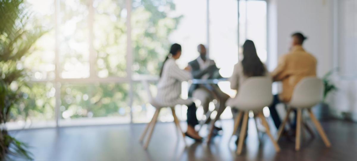 Coworkers meeting around a table